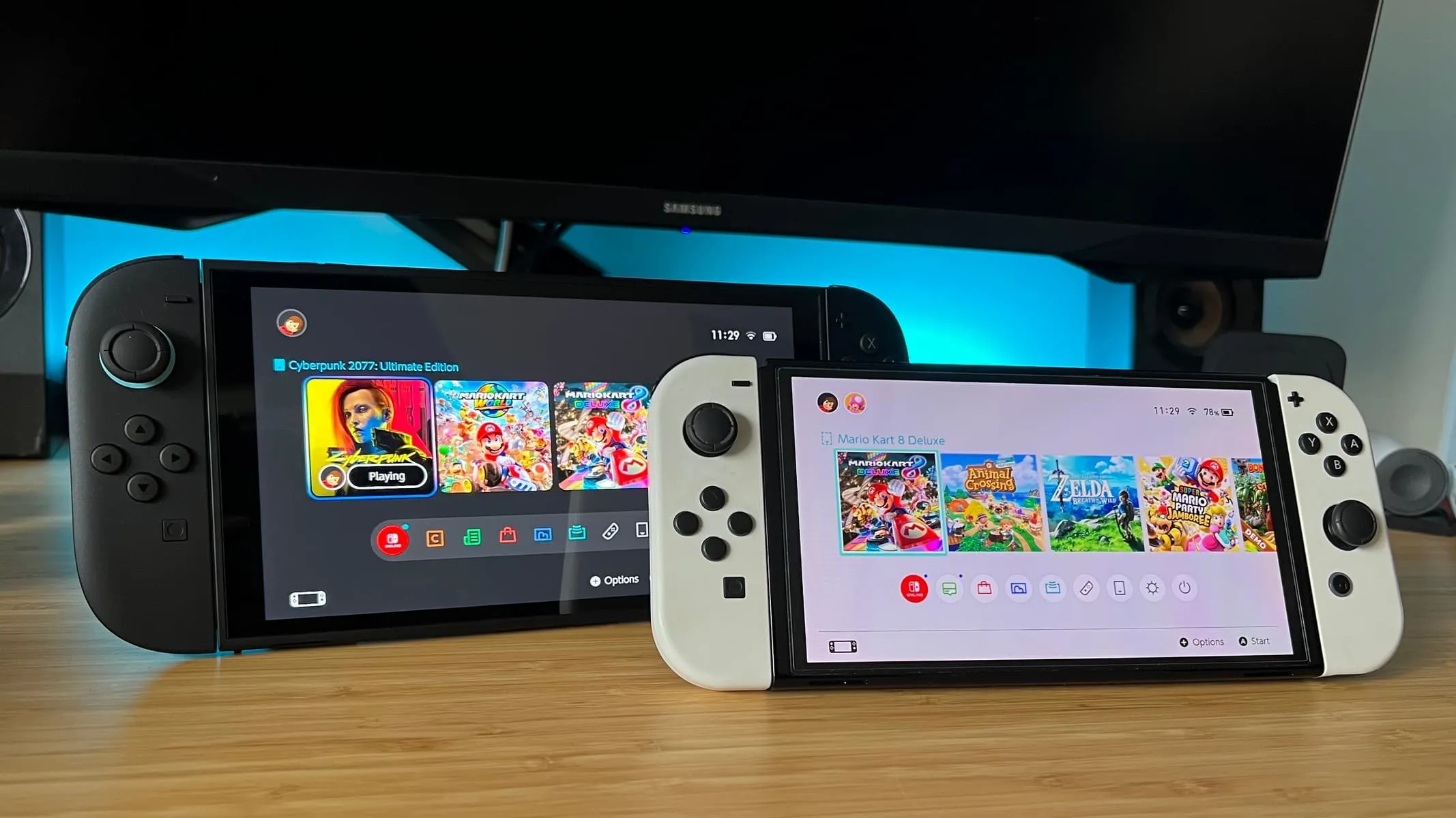 Nintendo Switch OLED і Switch 2 на столі з іграми