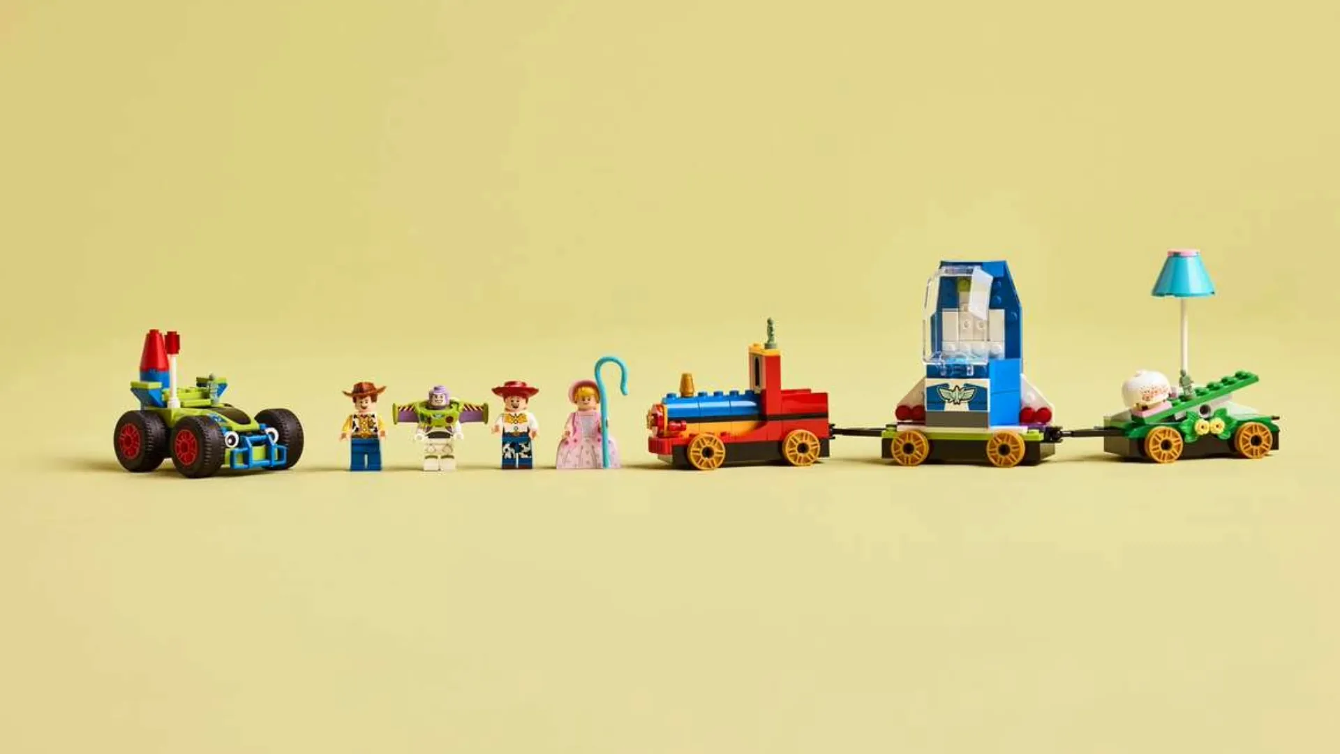 Конструктор LEGO Disney та Pixar Святкування з Історії Іграшок потяг і авто для перегонів (43264)